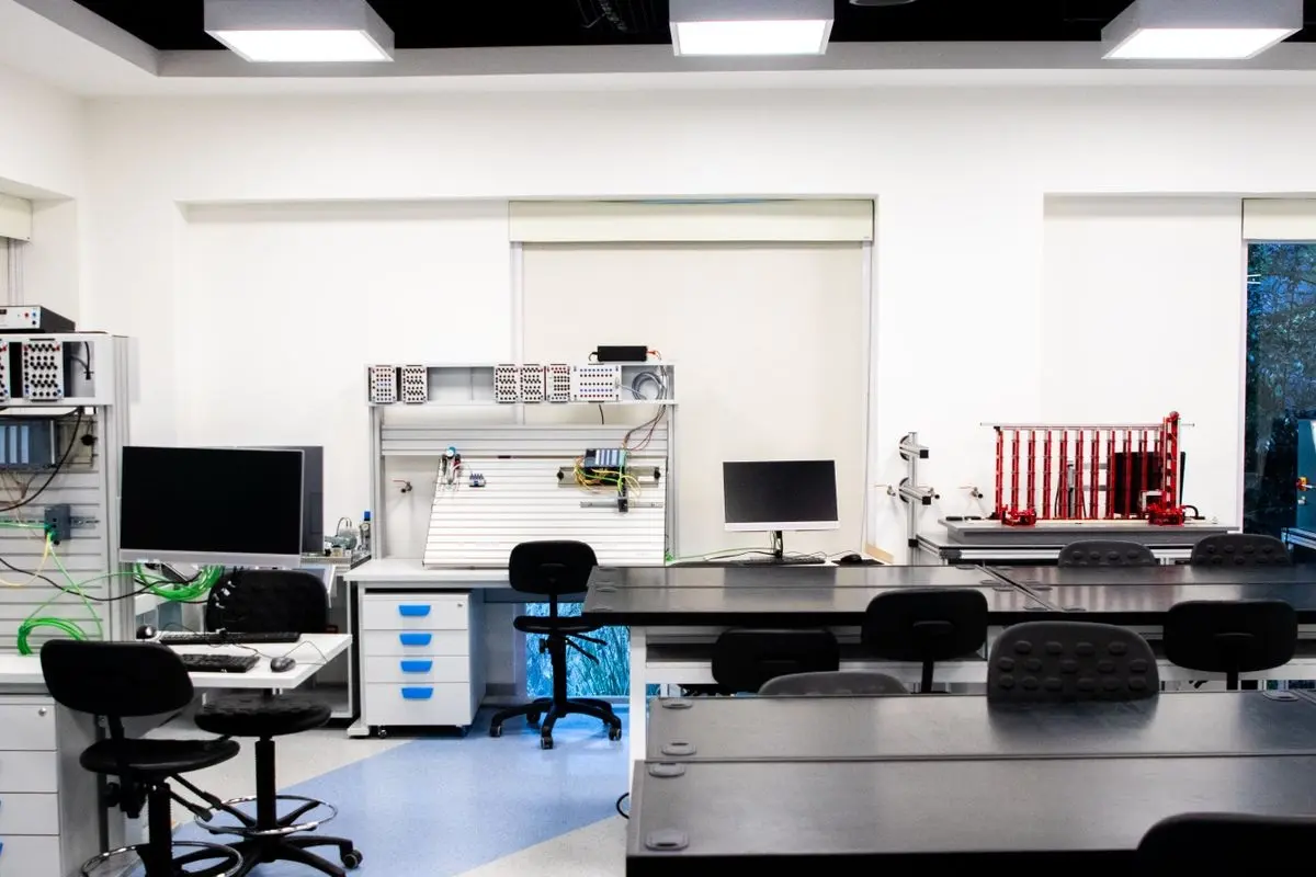 Electronics laboratory with workbenches, computers and testing equipment